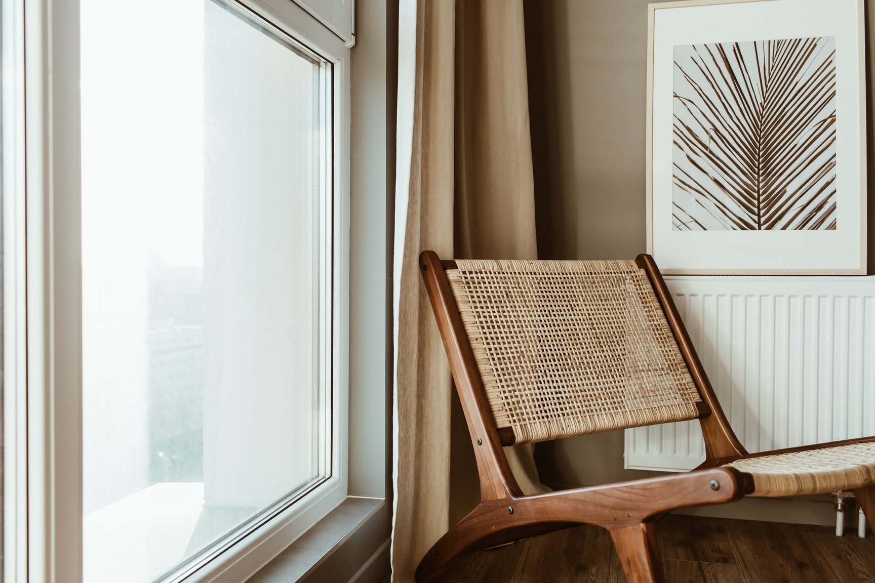 Wooden Chair Beside a Glass Window